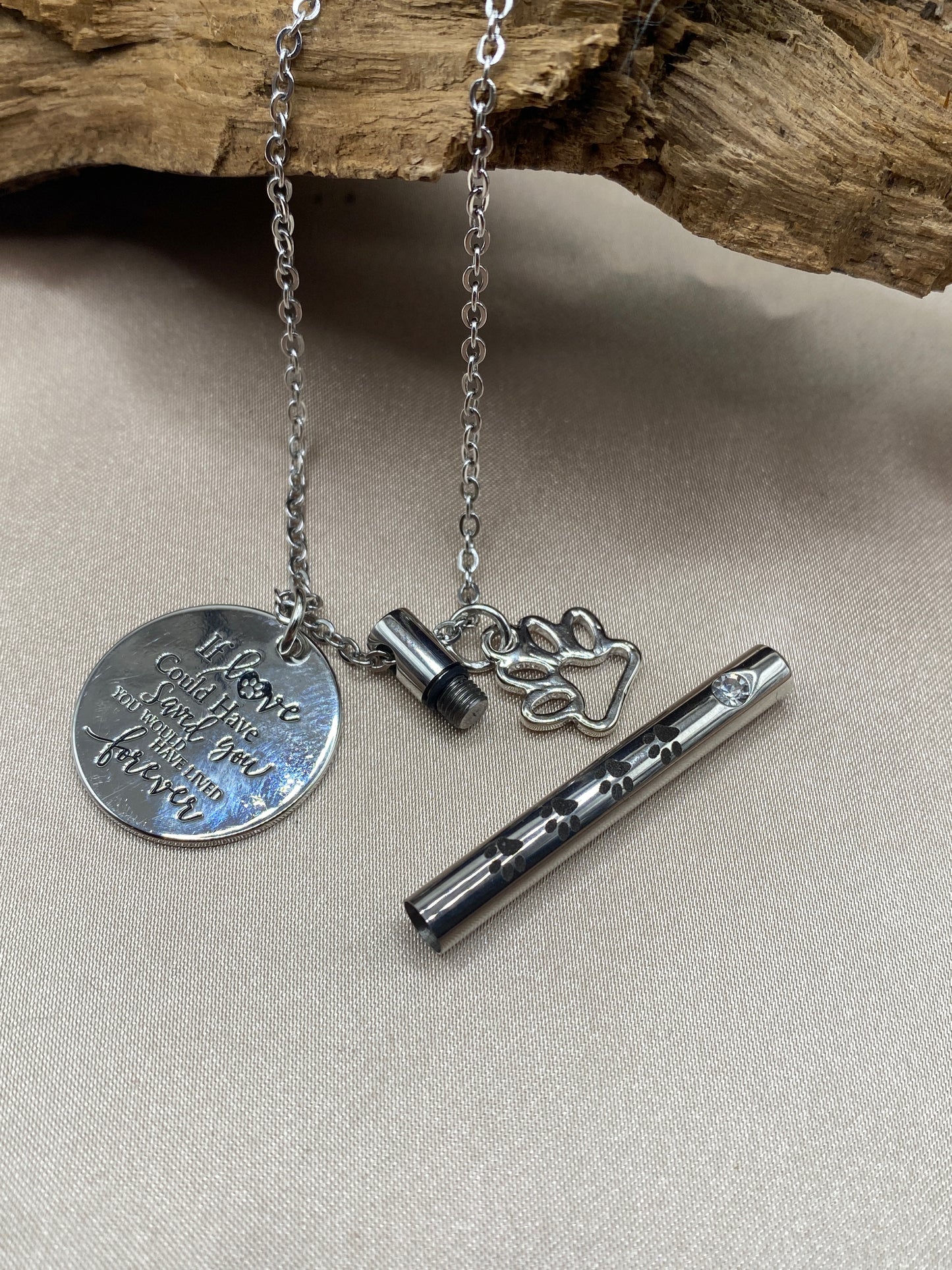 Cremation cylinder pendant with paw print charms