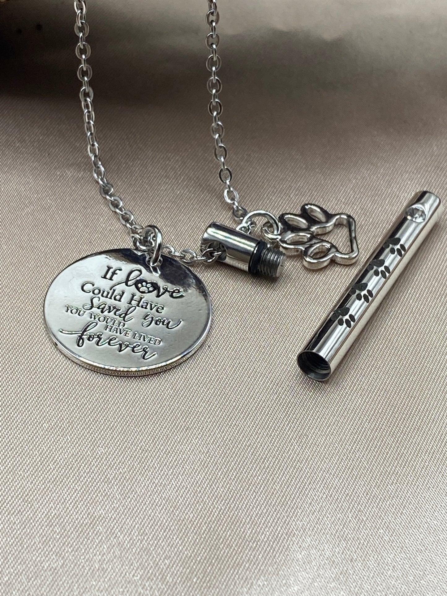 Cylinder cremation pendant with paw prints and charms