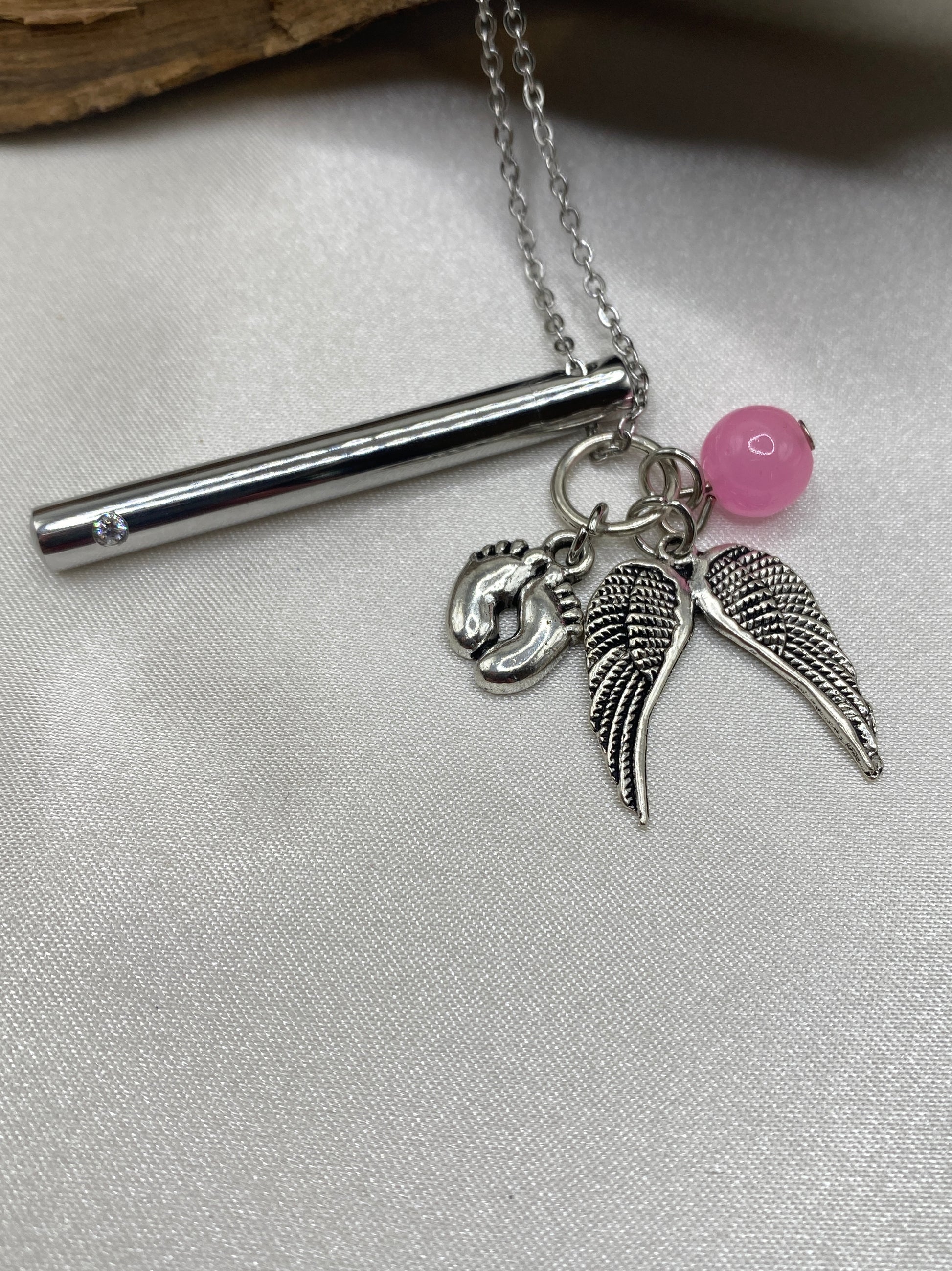 Cremation pendant with baby feet, pink bead and Angel wing charms
