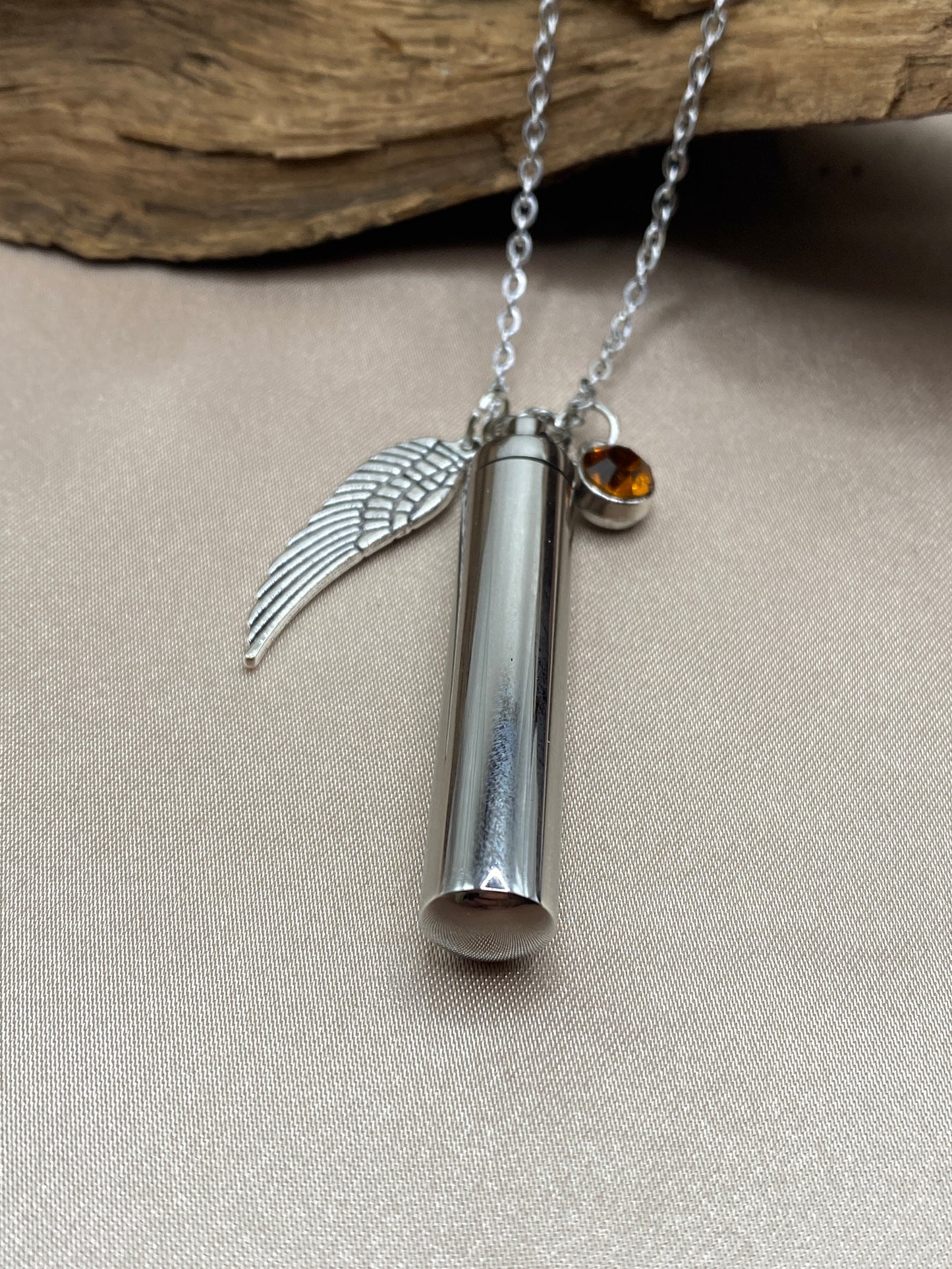 Cylinder cremation necklace with Angel wing charm and burnt orange stone