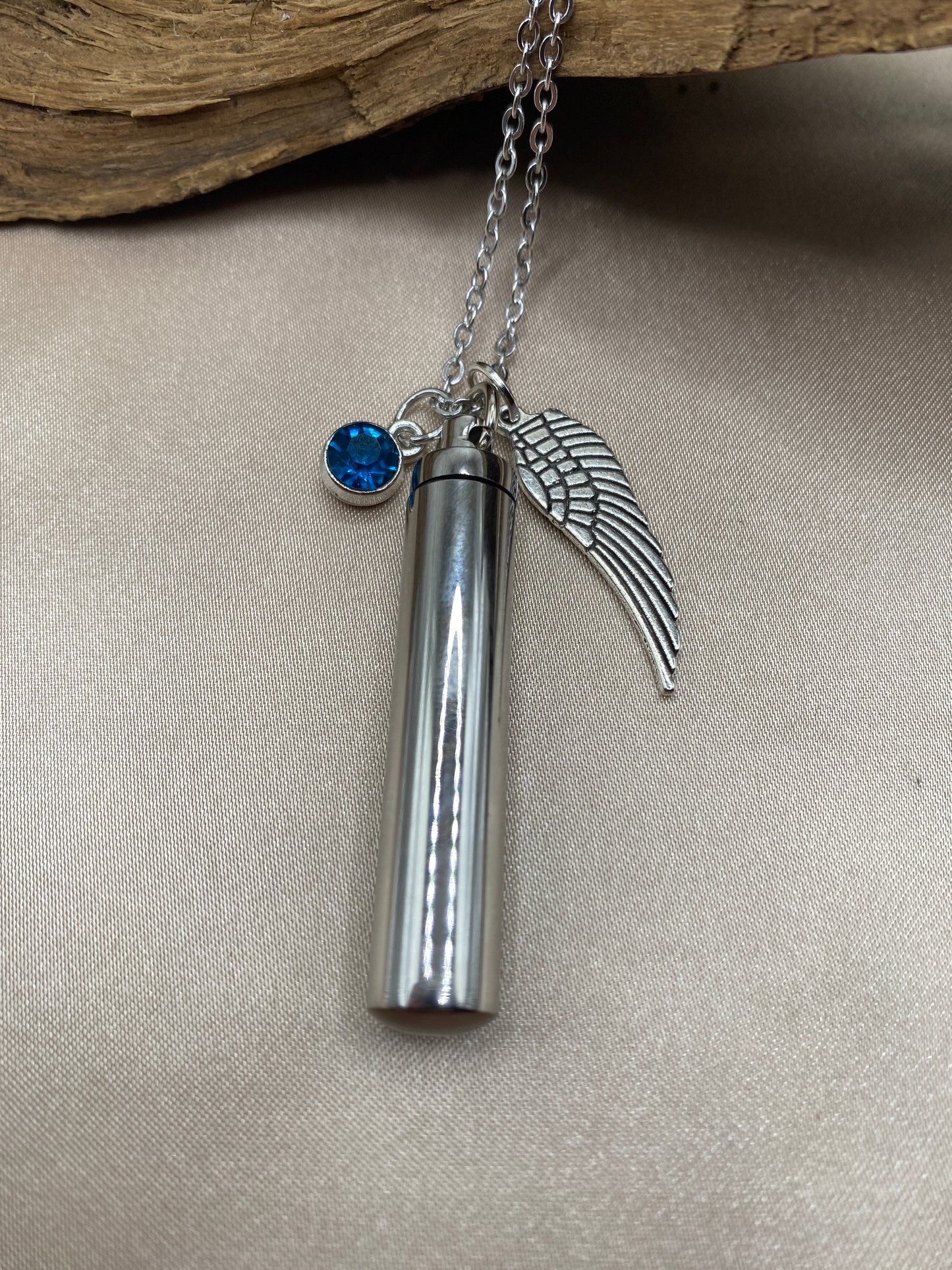 Cylinder cremation necklace with Angel wing charm and aqua blue stone