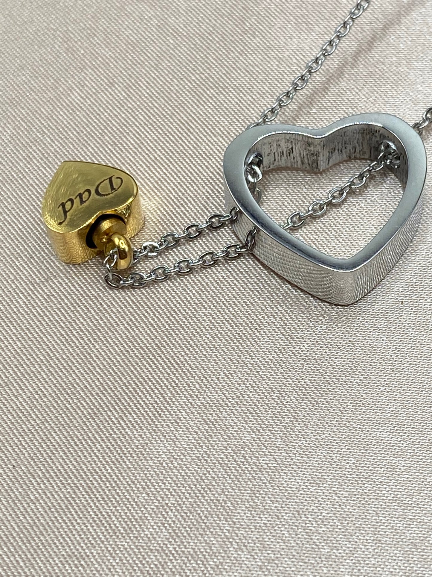 Silver heart and gold heart with chain