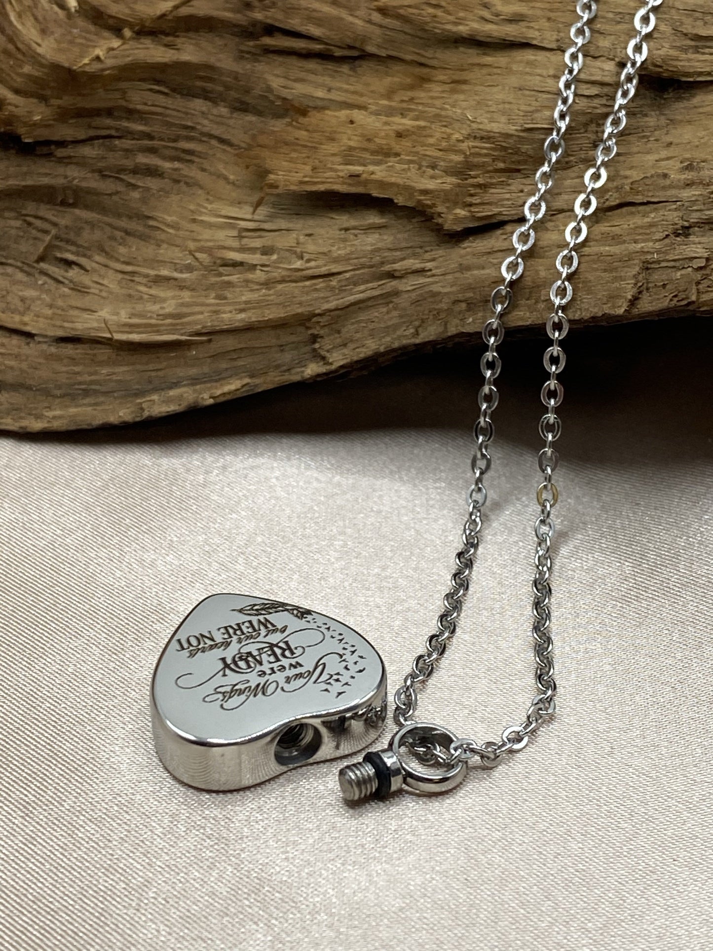 Twists open to hold human or pet ashes