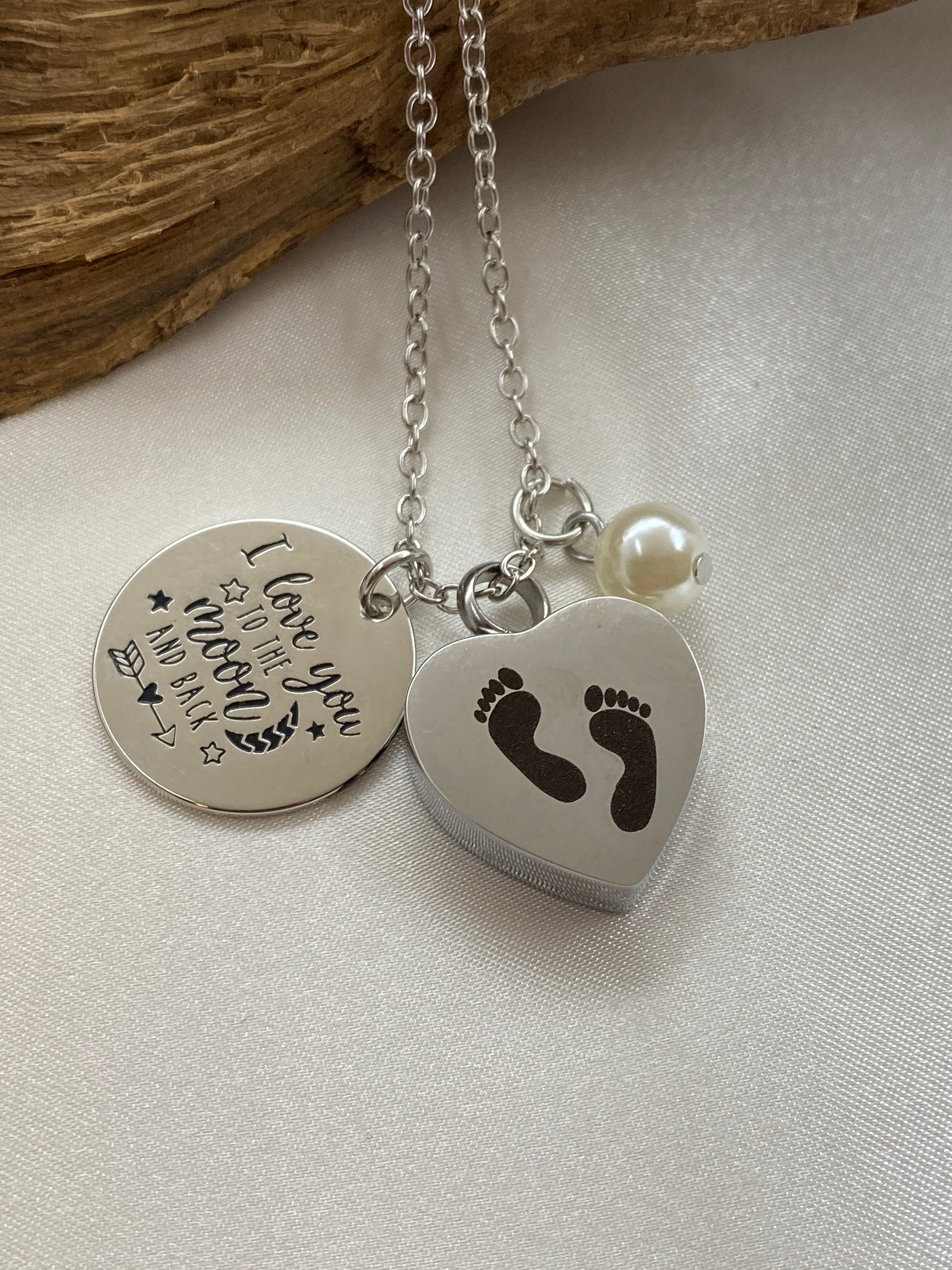 Stainless steel cremation necklace with baby feet