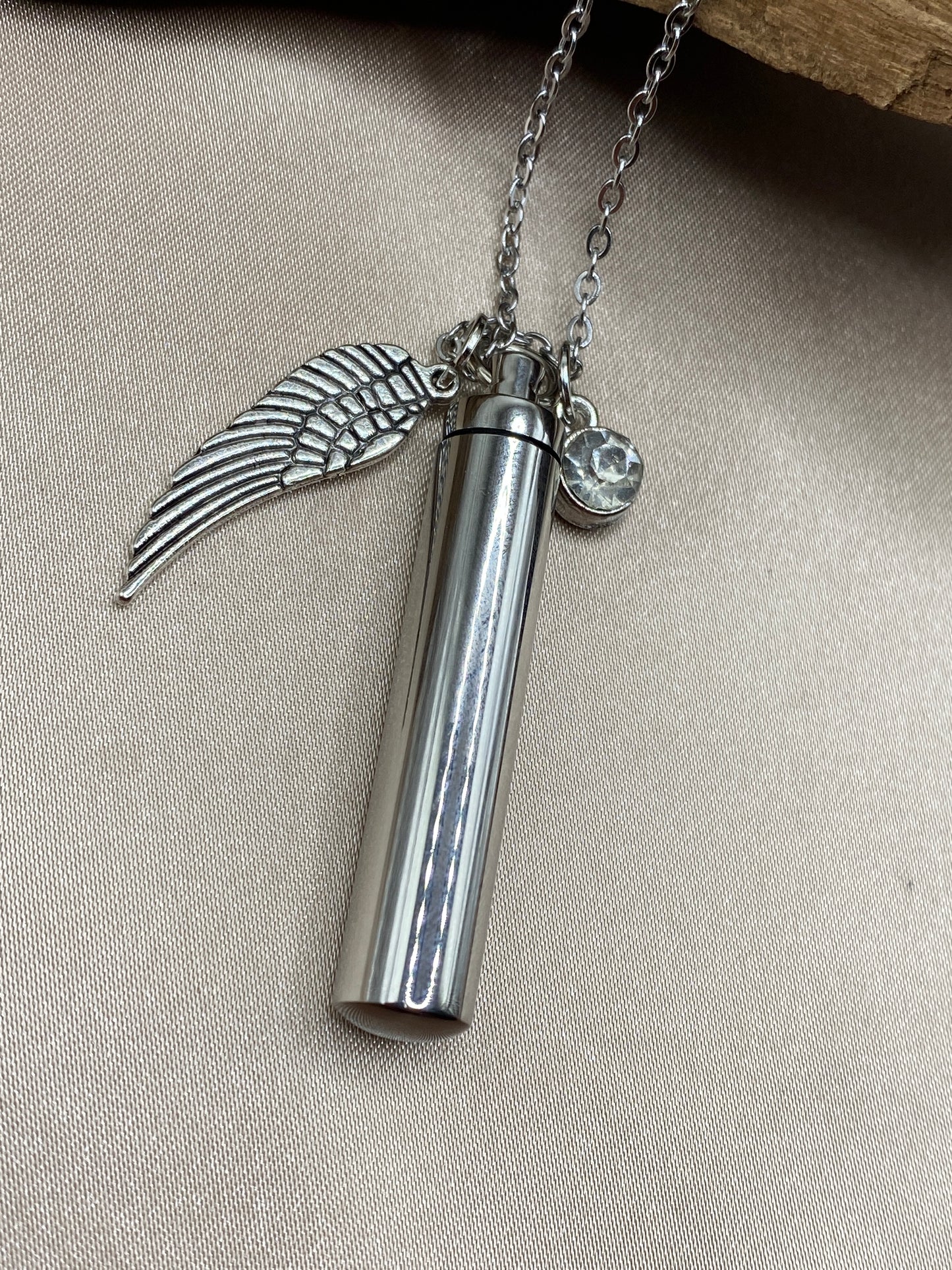 Cylinder cremation necklace with Angel wing charm and crystal stone