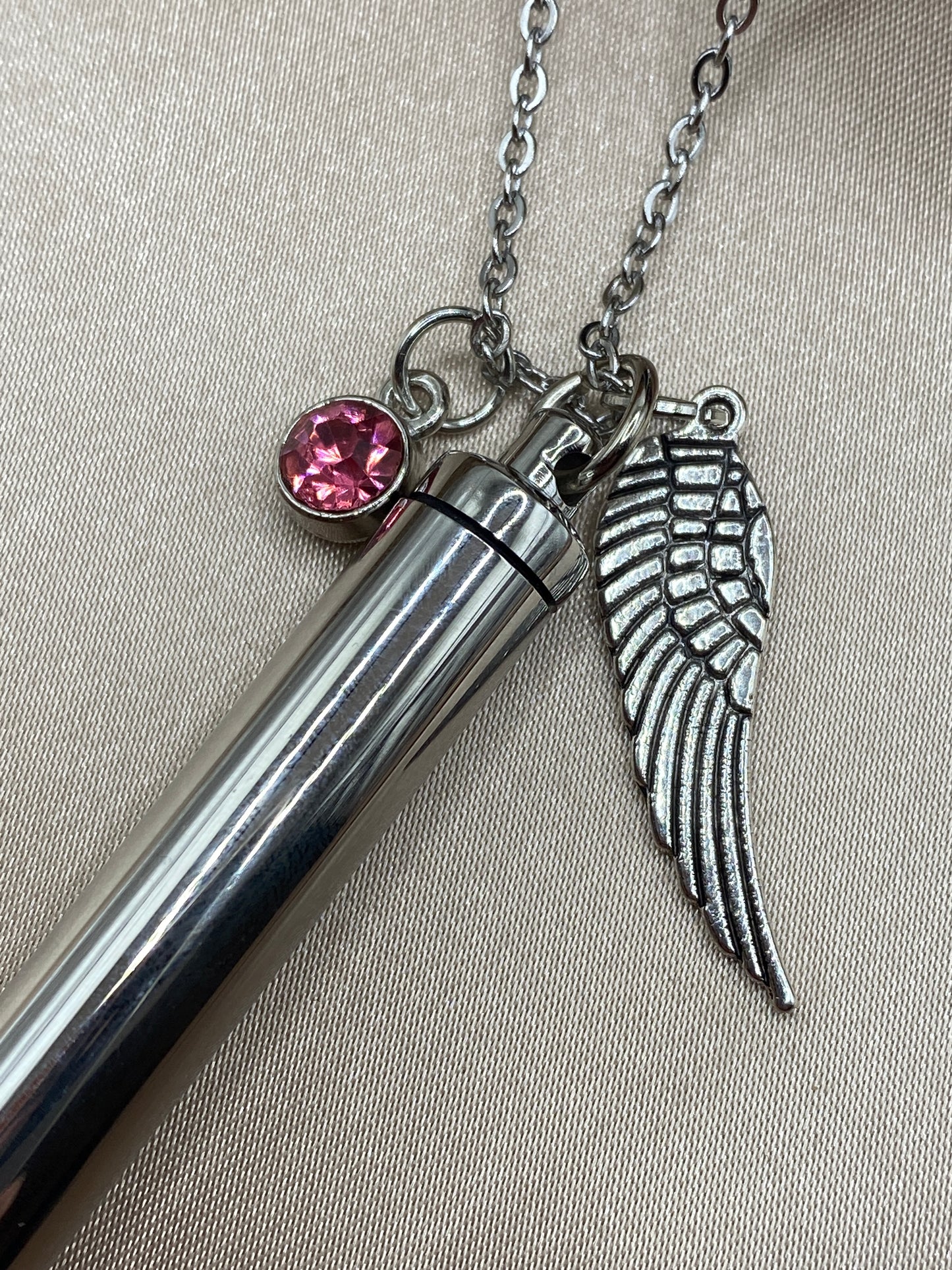 Cylinder cremation necklace with Angel wing charm and rosy pink stone