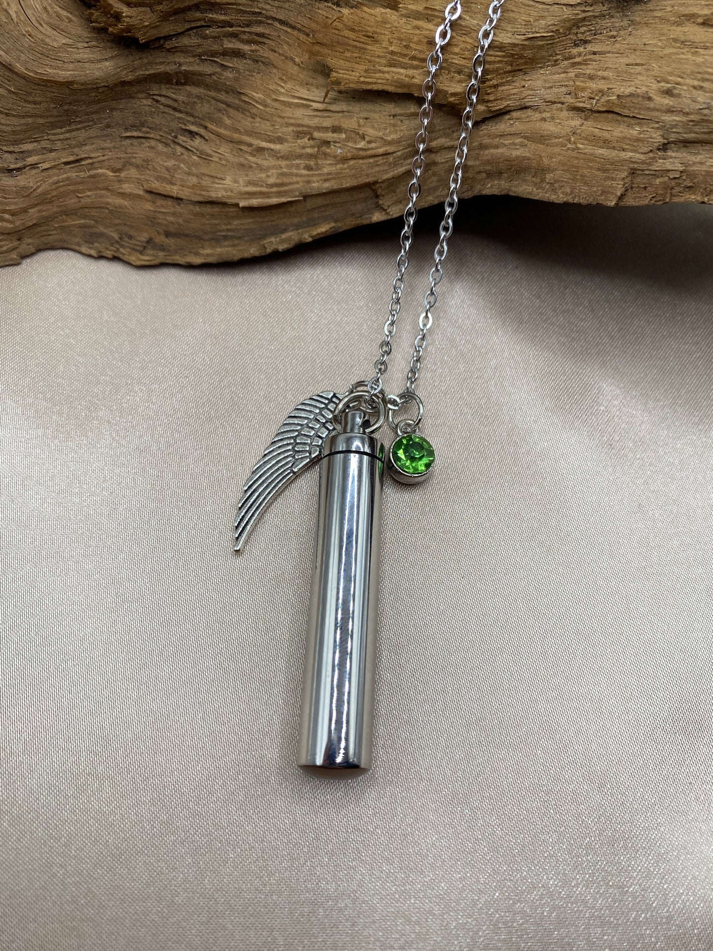 Cylinder cremation necklace with Angel wing charm and bright green stone
