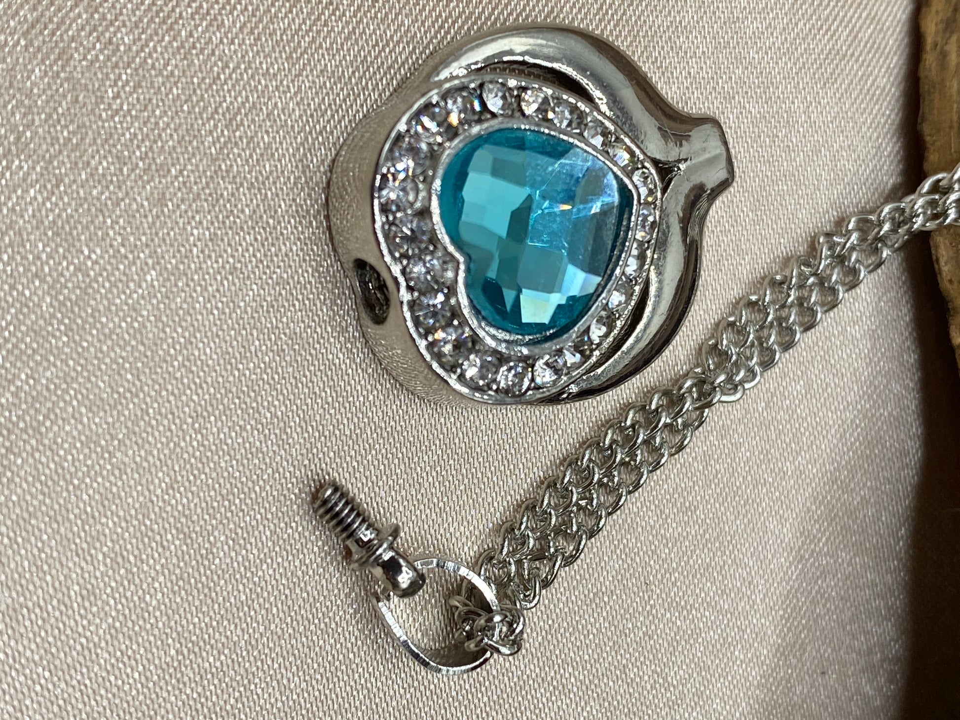 Blue stone heart holds ashes