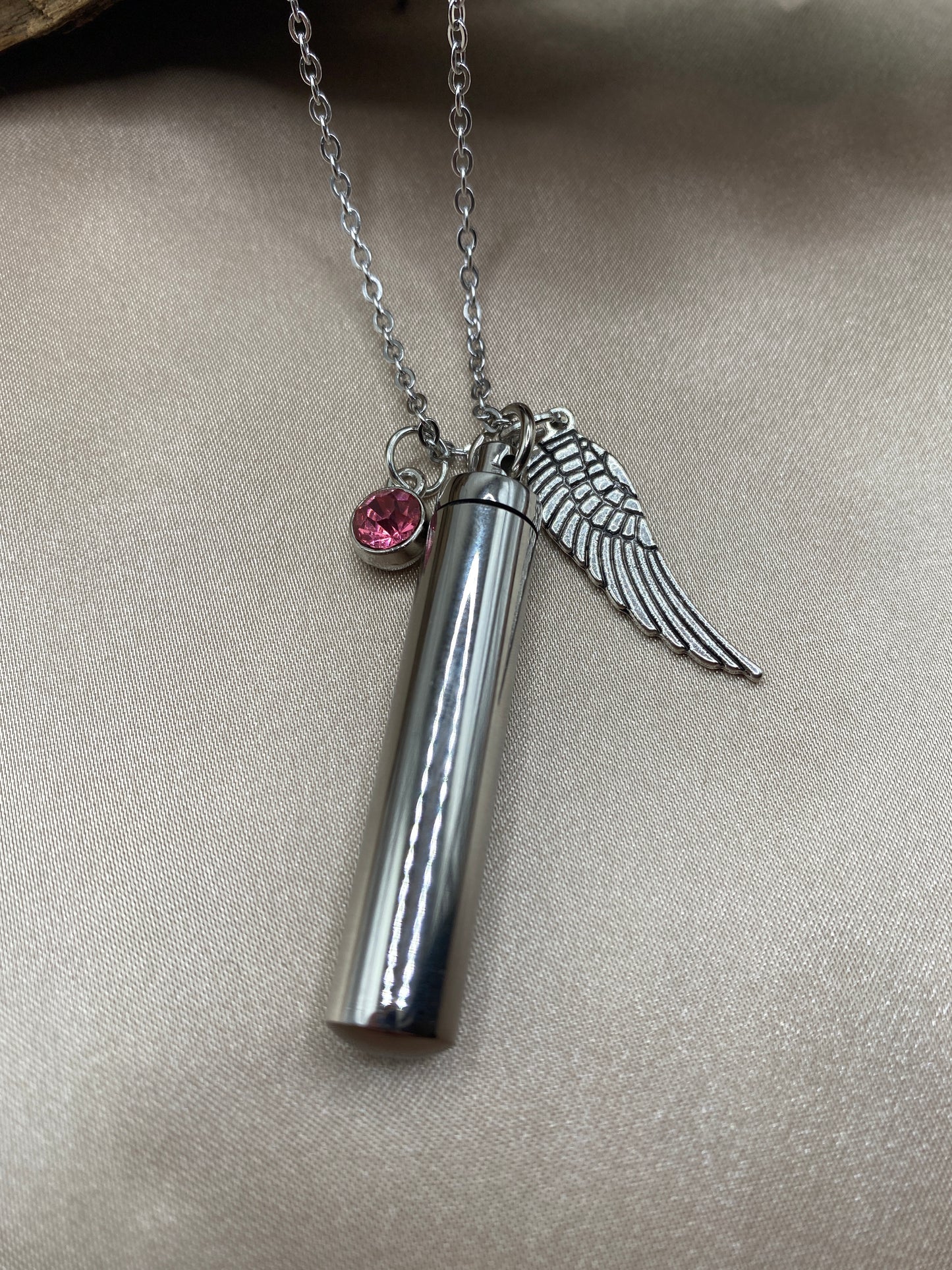 Cylinder cremation necklace with Angel wing charm and rosy pink stone
