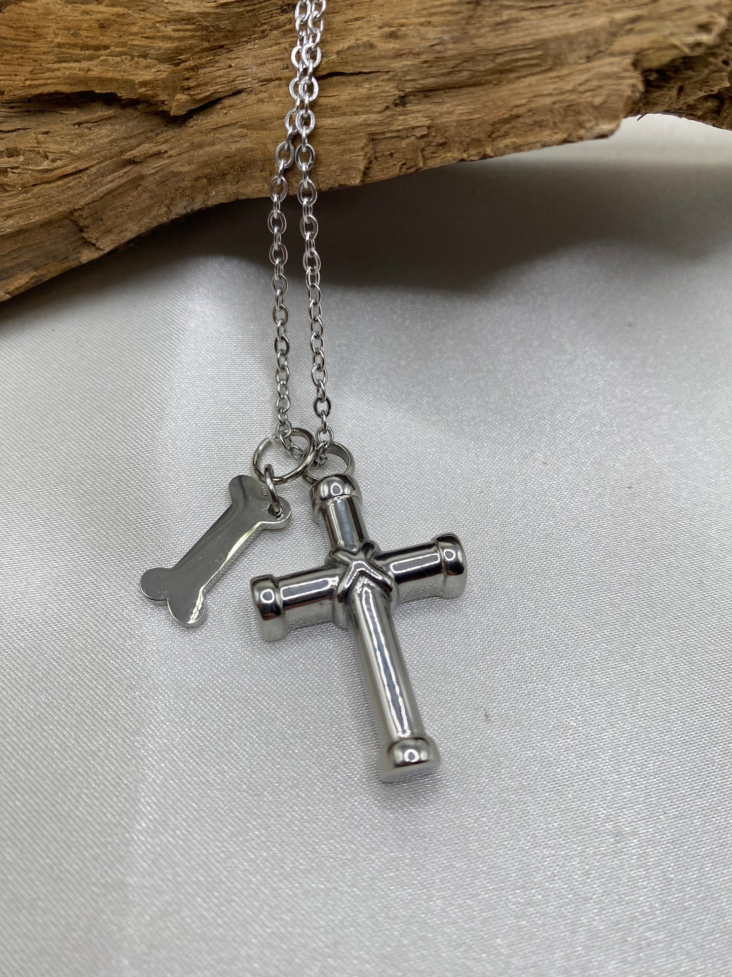 Cremation cross for pet ashes with dog bone charm