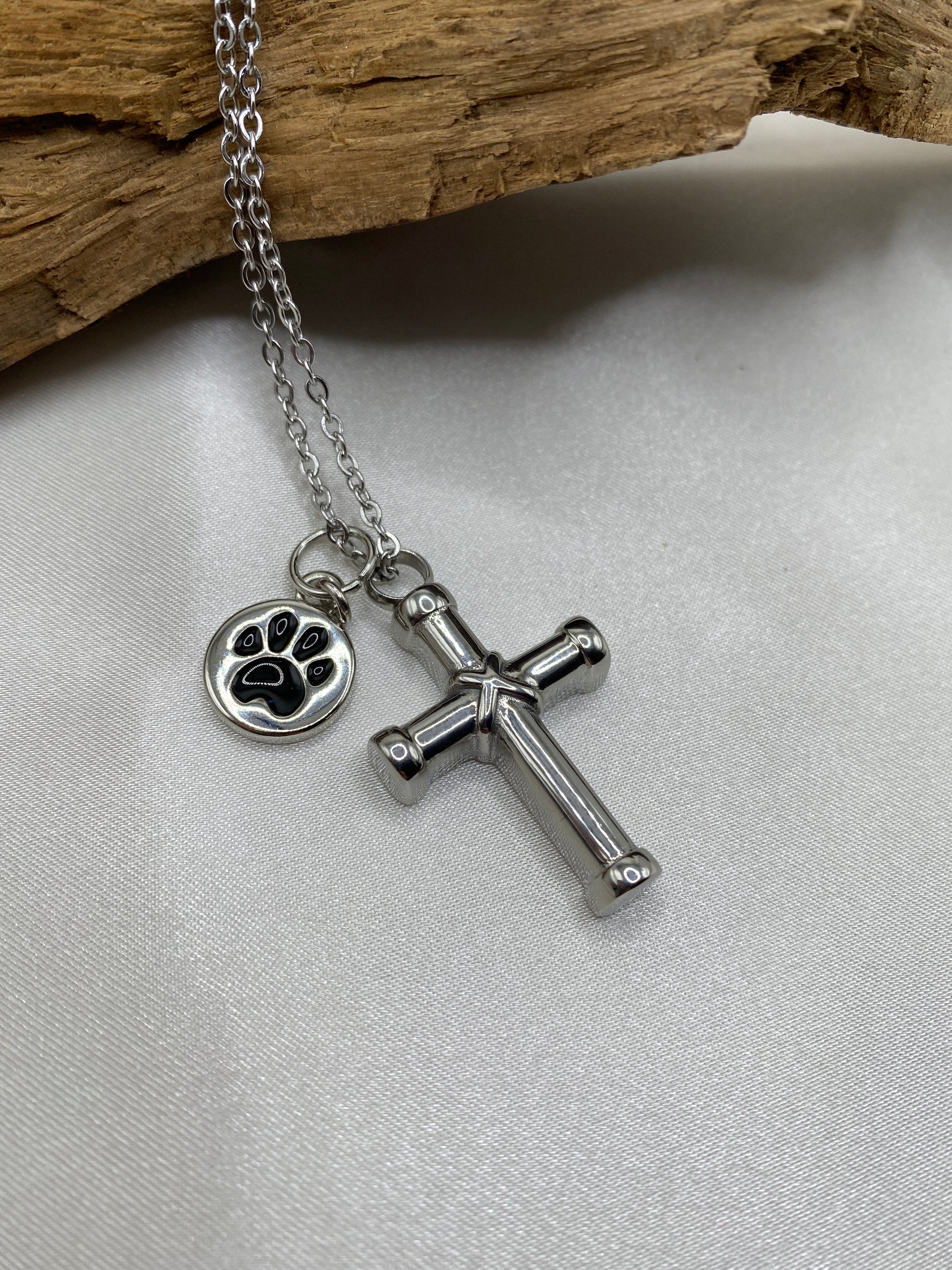 Cremation cross for pet ashes with paw print charm