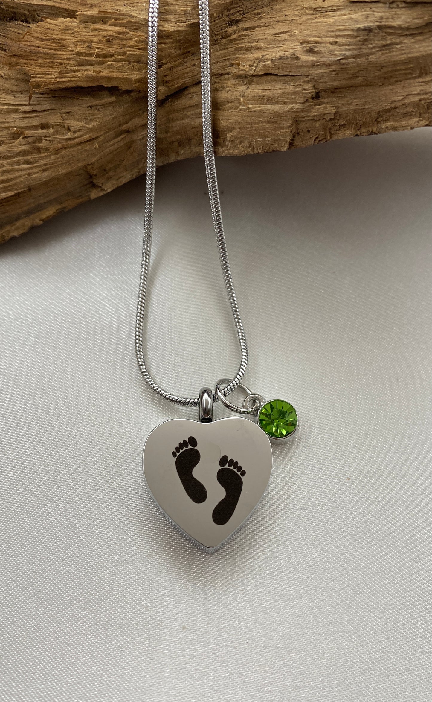 Baby feet cremation heart necklace with bright green stone