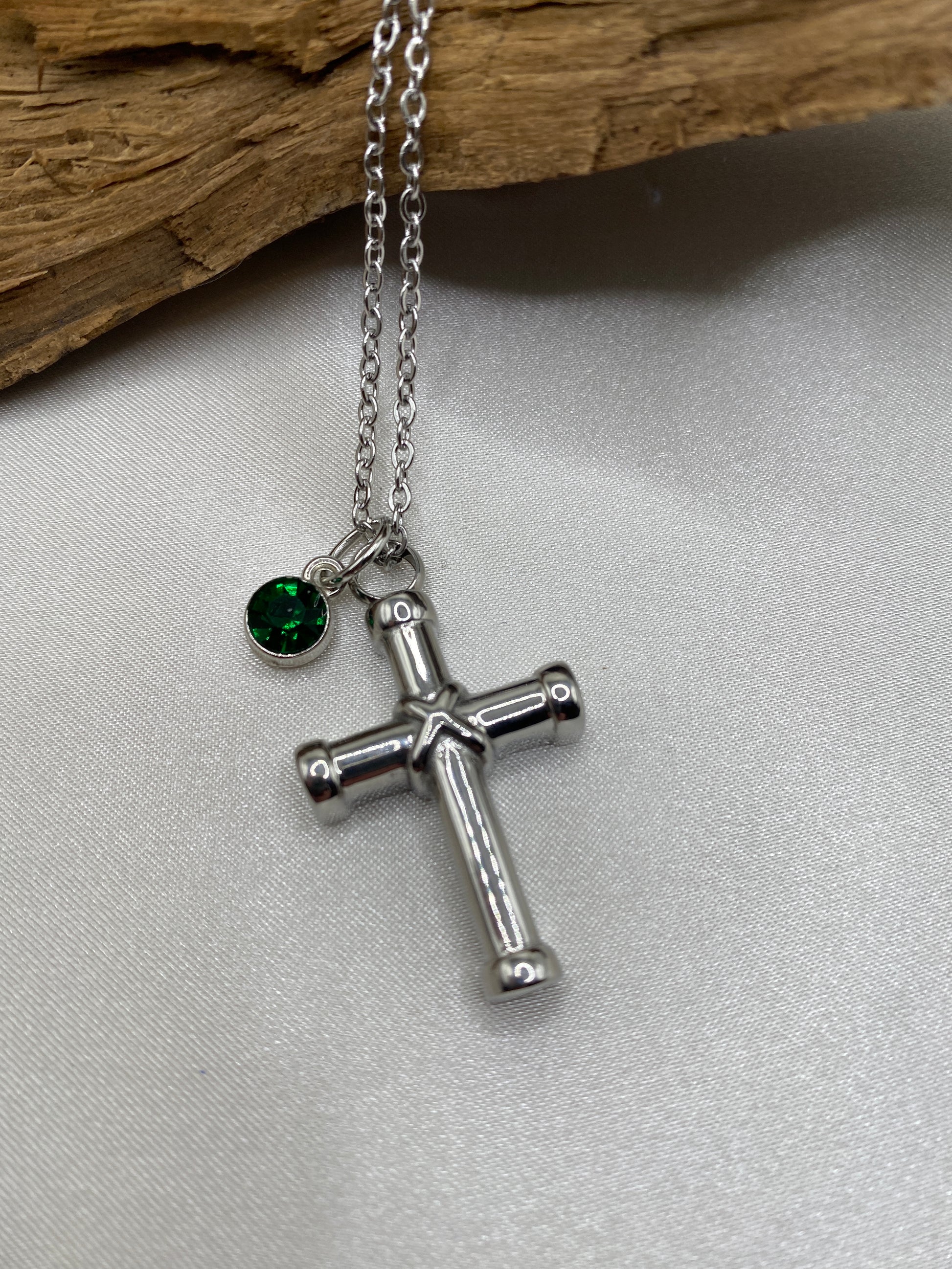 cremation cross necklace for ashes with bright green Stone