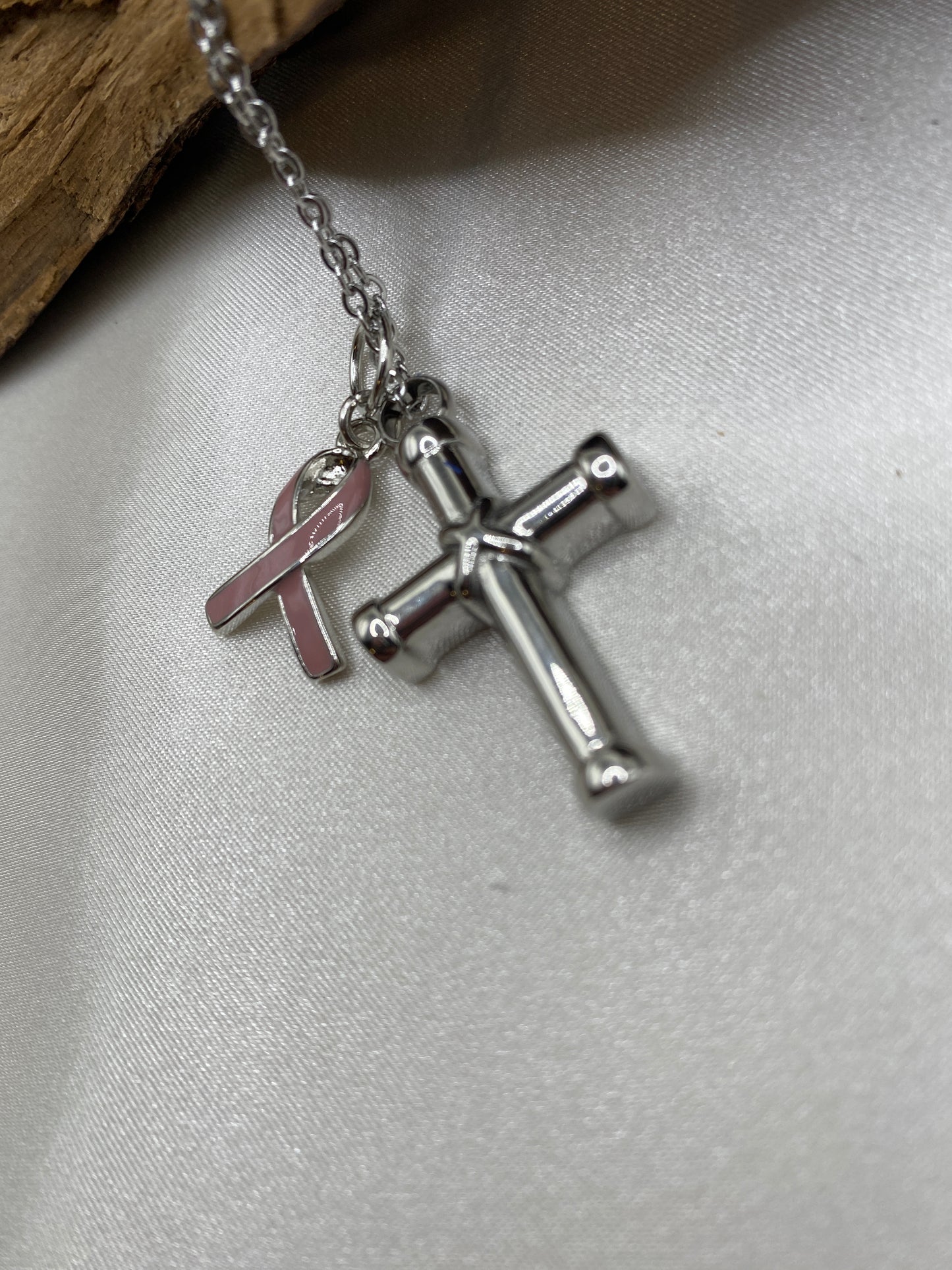 Cremation cross for ashes with Breast Cancer Awareness charm