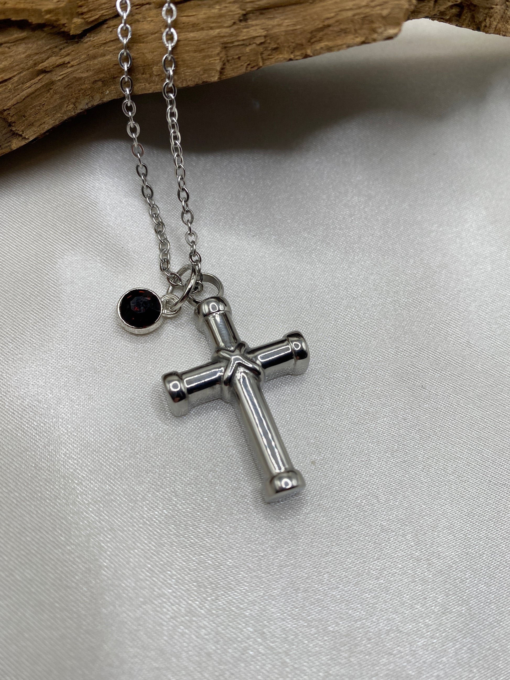 cremation cross necklace for ashes with burgundy Stone