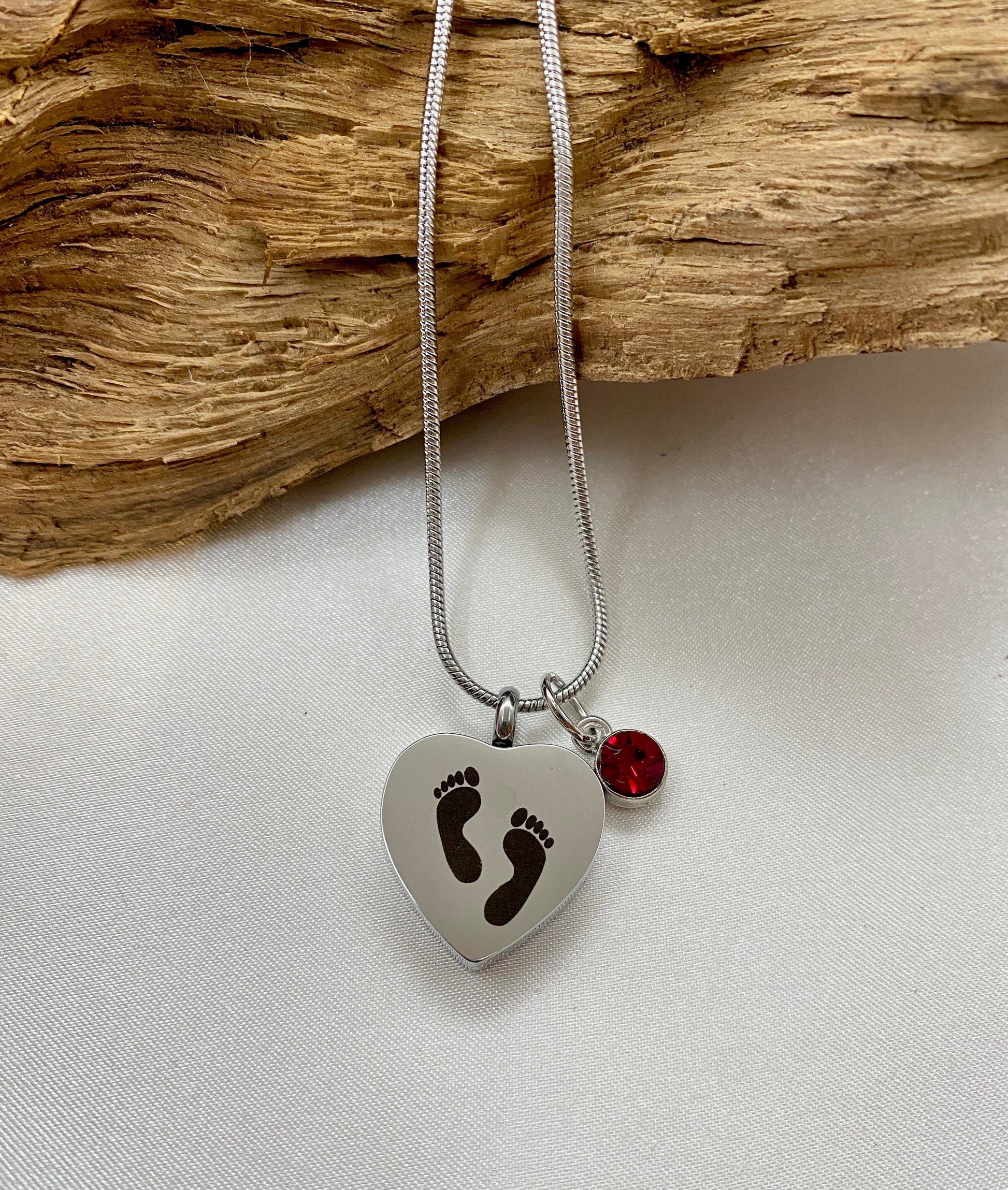 Baby feet cremation heart necklace with red rose stone