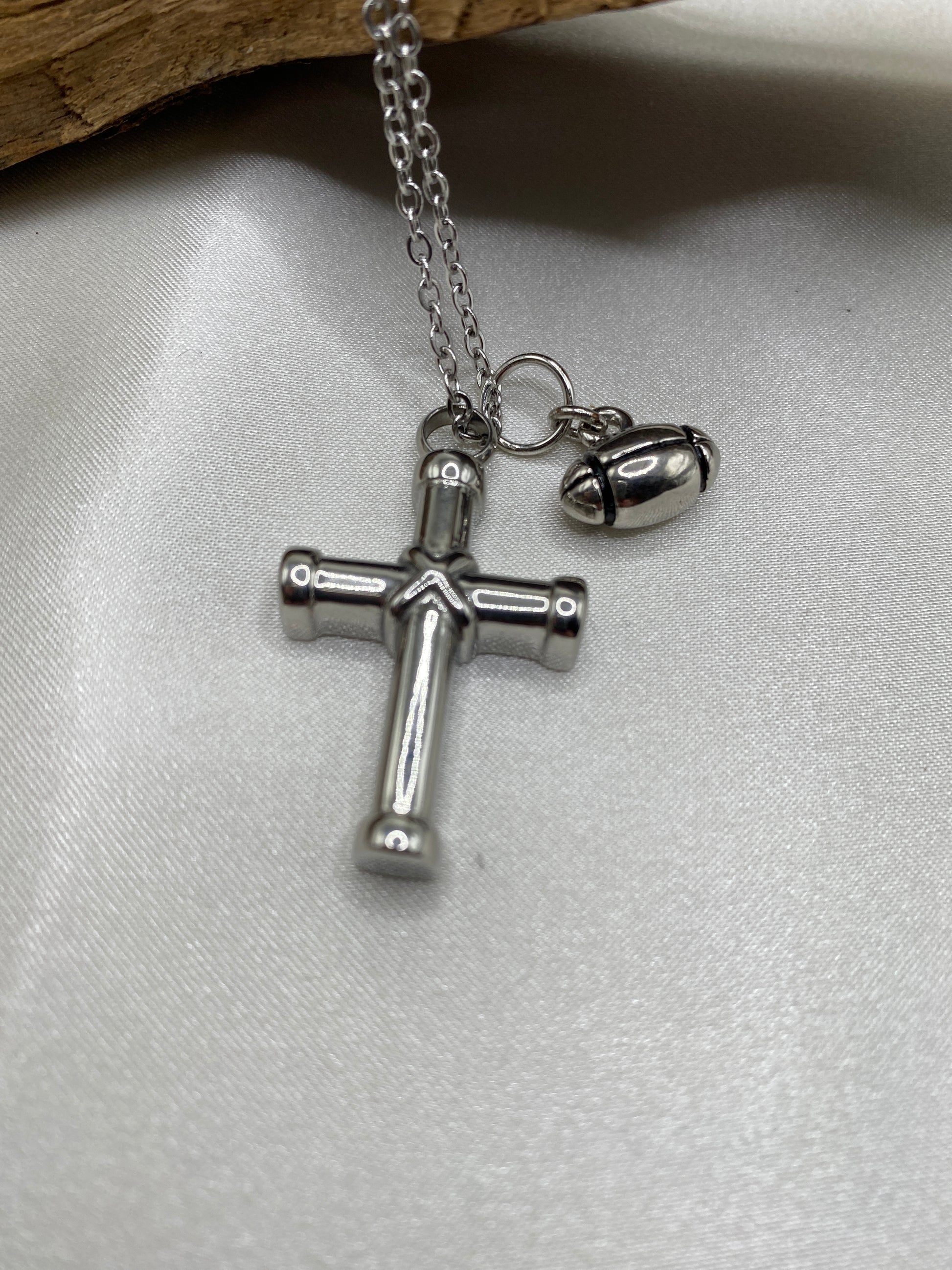 Cremation cross for ashes with football charm